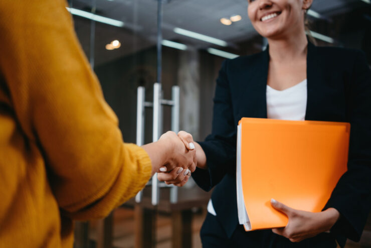 A person shaking hands with another person