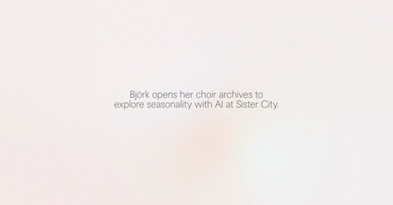 A minimal light-colored background displays a short line of centered text reading “Björk opens her choir archives to explore seasonality with AI at Sister City.” The rest of the image is empty, emphasizing the text.